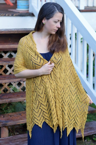 Draped over both shoulders